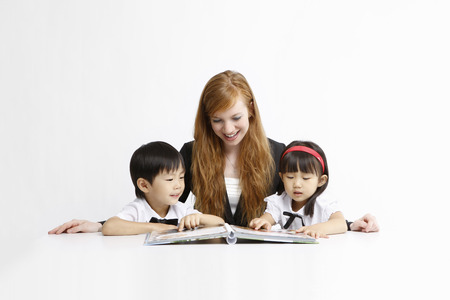 Asian kids with education concept- Isolated on studio shotの写真素材