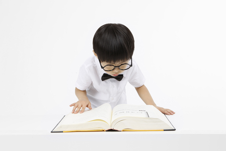 Asian kids with education concept- Isolated on studio shotの写真素材