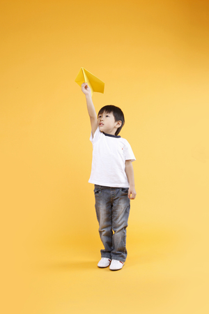 Asian kids with education concept- Isolated on studio shotの写真素材