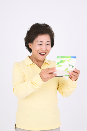 Old asian couple's happy daily life - isolated on whiteのeditorial素材