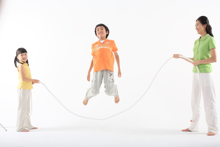 Working out with asian children - isolated on whiteの写真素材