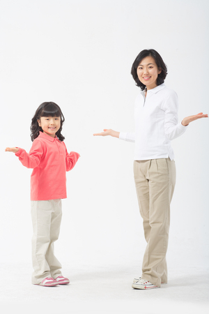 Asian mom and child - isolated on whiteの写真素材