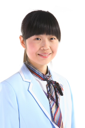 Asian flight attendant posing in the studio - isolated on whiteの写真素材