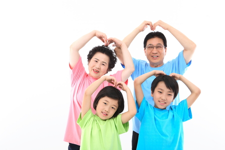 Asian grand parents and two kids - isolated on whiteの写真素材