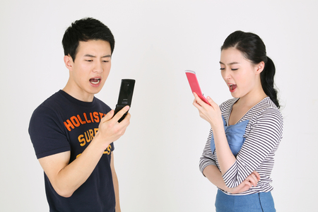 Asian couple in studio - isolated on whiteのeditorial素材