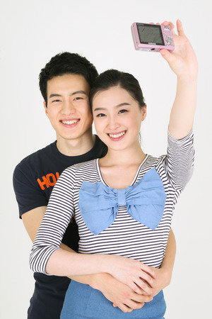Asian couple in studio - isolated on whiteのeditorial素材