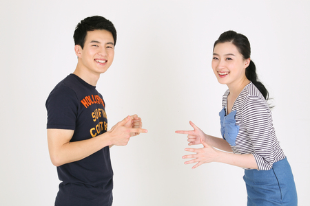 Asian couple in studio - isolated on whiteのeditorial素材