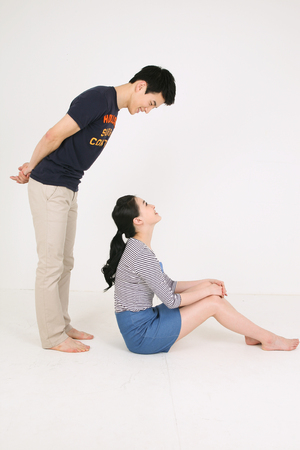 Asian couple in studio - isolated on whiteのeditorial素材