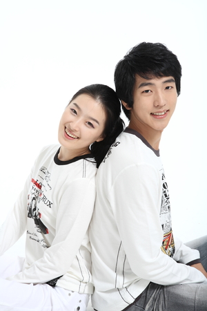 Asian young couple in studio - isolated on whiteのeditorial素材