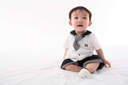 Asian baby boy in studio - isolated on whiteの写真素材