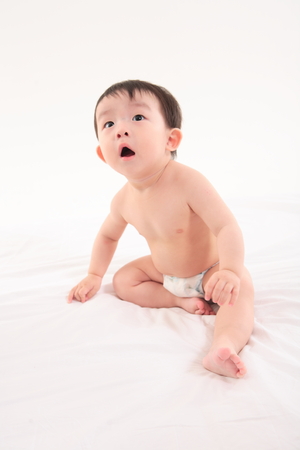 Asian baby boy in studio - isolated on whiteの写真素材