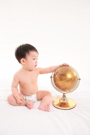 Asian baby boy in studio - isolated on whiteの写真素材