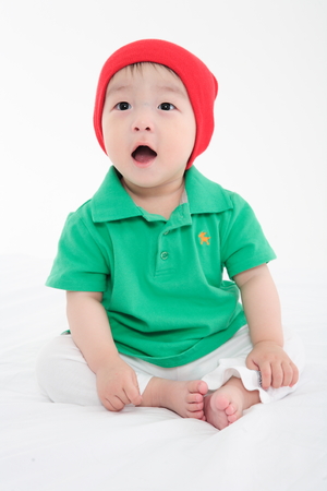 Asian baby boy in studio - isolated on whiteの写真素材