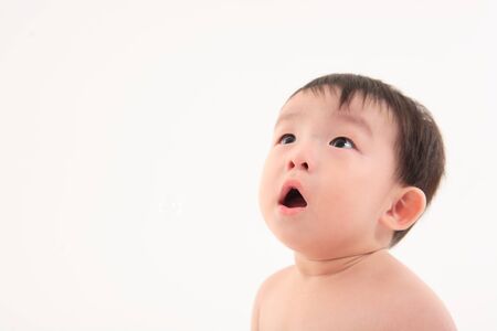 Asian baby boy in studio - isolated on whiteの写真素材