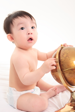 Asian baby boy in studio - isolated on whiteの写真素材