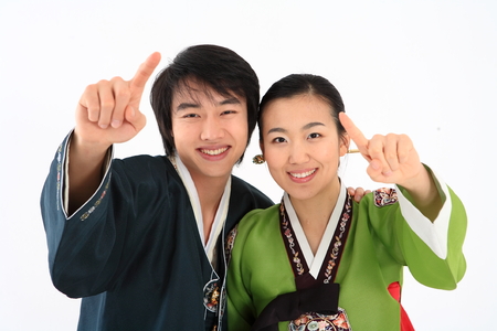 Korean couple with traditional clothing - isolated on whiteの写真素材