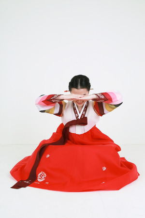 Korean woman with traditional clothing - isolated on whiteの写真素材