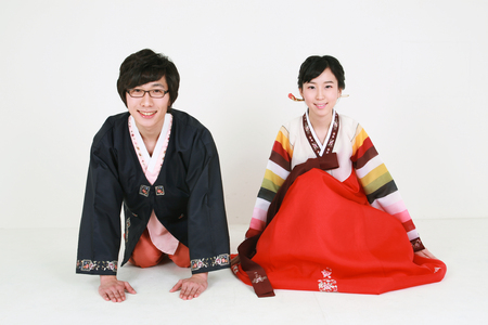 Korean young couple with traditional clothing - isolated on whiteの写真素材