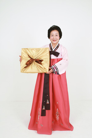 Korean grandmother with traditional clothing - isolated on whiteの写真素材