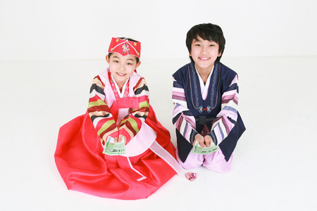 Korean kids with traditional clothing - isolated on whiteの写真素材
