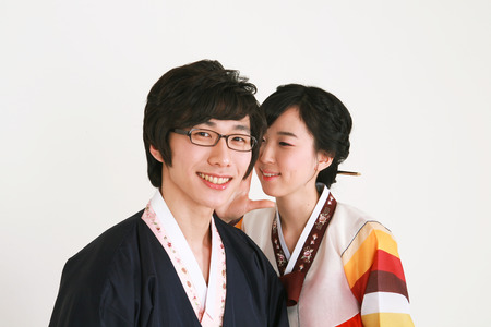 Korean couple with traditional clothing - isolated on whiteの写真素材