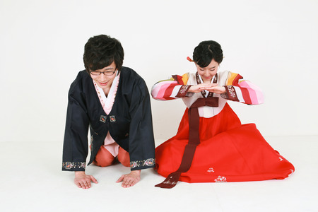 Korean young couple with traditional clothing - isolated on whiteの写真素材