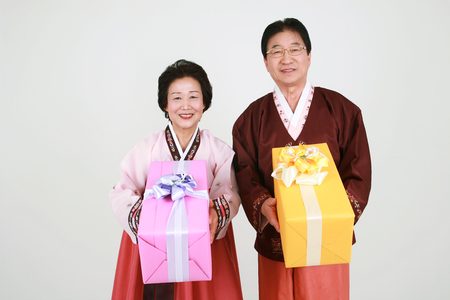 Korean grandparents with traditional clothing - isolated on whiteの写真素材