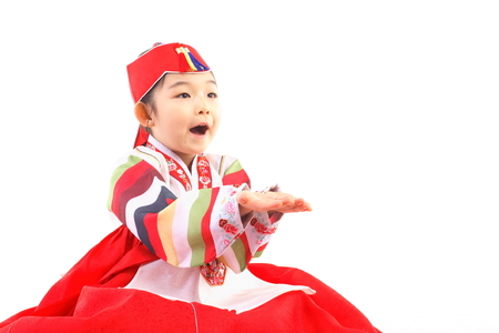 Korean little girl with traditional clothing - isolated on whiteの写真素材