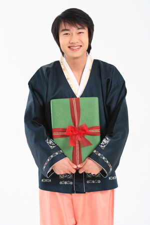 Young korean man with traditional clothing - isolated on whiteの写真素材