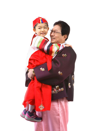 Korean grandfather and little girl with traditional clothing - isolated on whiteの写真素材