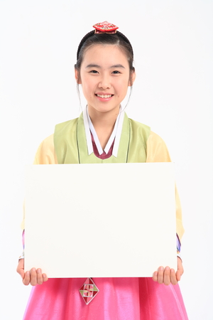 Korean teenage girl with traditional clothing - isolated on whiteの写真素材