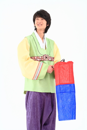 Korean young man with traditional clothing - isolated on whiteの写真素材