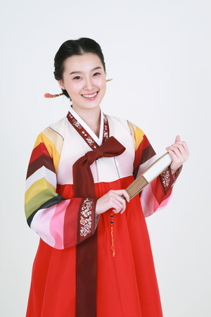 Asian man and woman with traditional clothing perfoming traditional play - isolated on whiteの写真素材