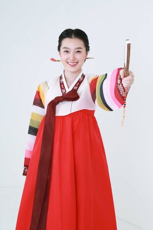 Asian man and woman with traditional clothing perfoming traditional play - isolated on whiteの写真素材