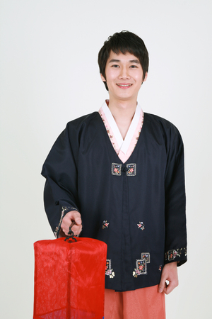 Asian man and woman with traditional clothing perfoming traditional play - isolated on whiteの写真素材