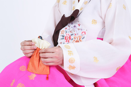 Asian woman with traditional clothing perfoming traditional play - isolated on whiteの写真素材