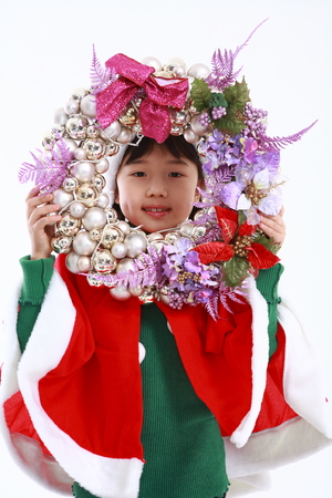 Asian kids with santa outfit and gifts- isolated on whiteの写真素材