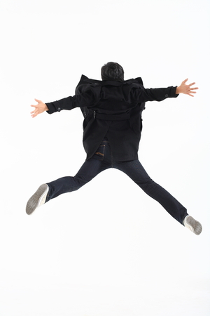 Young asian man posing in studio - isolated on whiteの写真素材