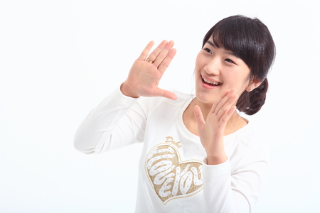 Young lady in studio - isolated on whiteの写真素材