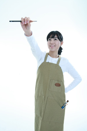 Asian woman majoring in art - isolated on whiteのeditorial素材