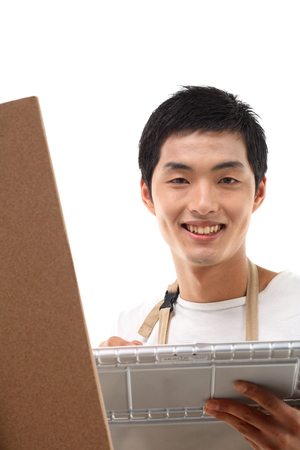 Asian man majoring in art - isolated on whiteの写真素材