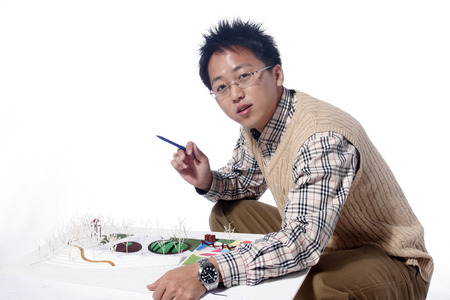 Asian man majoring in architecture - isolated on whiteのeditorial素材