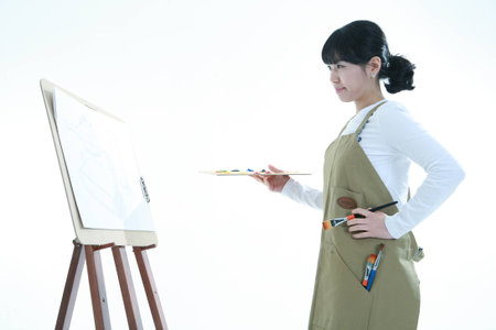 Asian woman majoring in art - isolated on whiteのeditorial素材