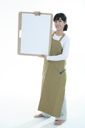 Asian woman majoring in art - isolated on whiteの写真素材