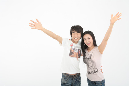 Young college students in studio - isolated on whiteの写真素材