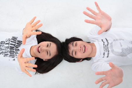 Young college students in studio - isolated on whiteの写真素材