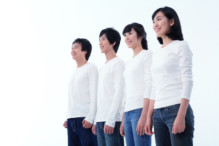 Young college students in studio - isolated on whiteの写真素材