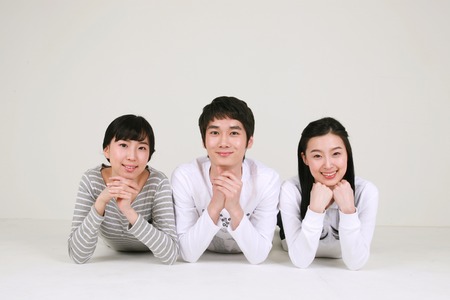 College students in studio - isolated on whiteの写真素材