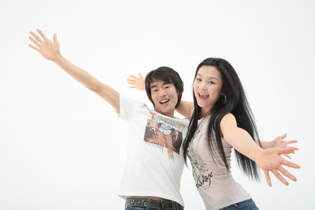 Young college students in studio - isolated on whiteの写真素材