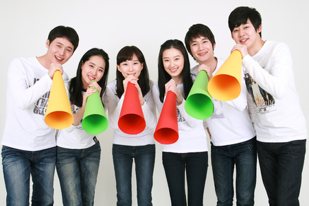 Young college students in studio - isolated on whiteの写真素材